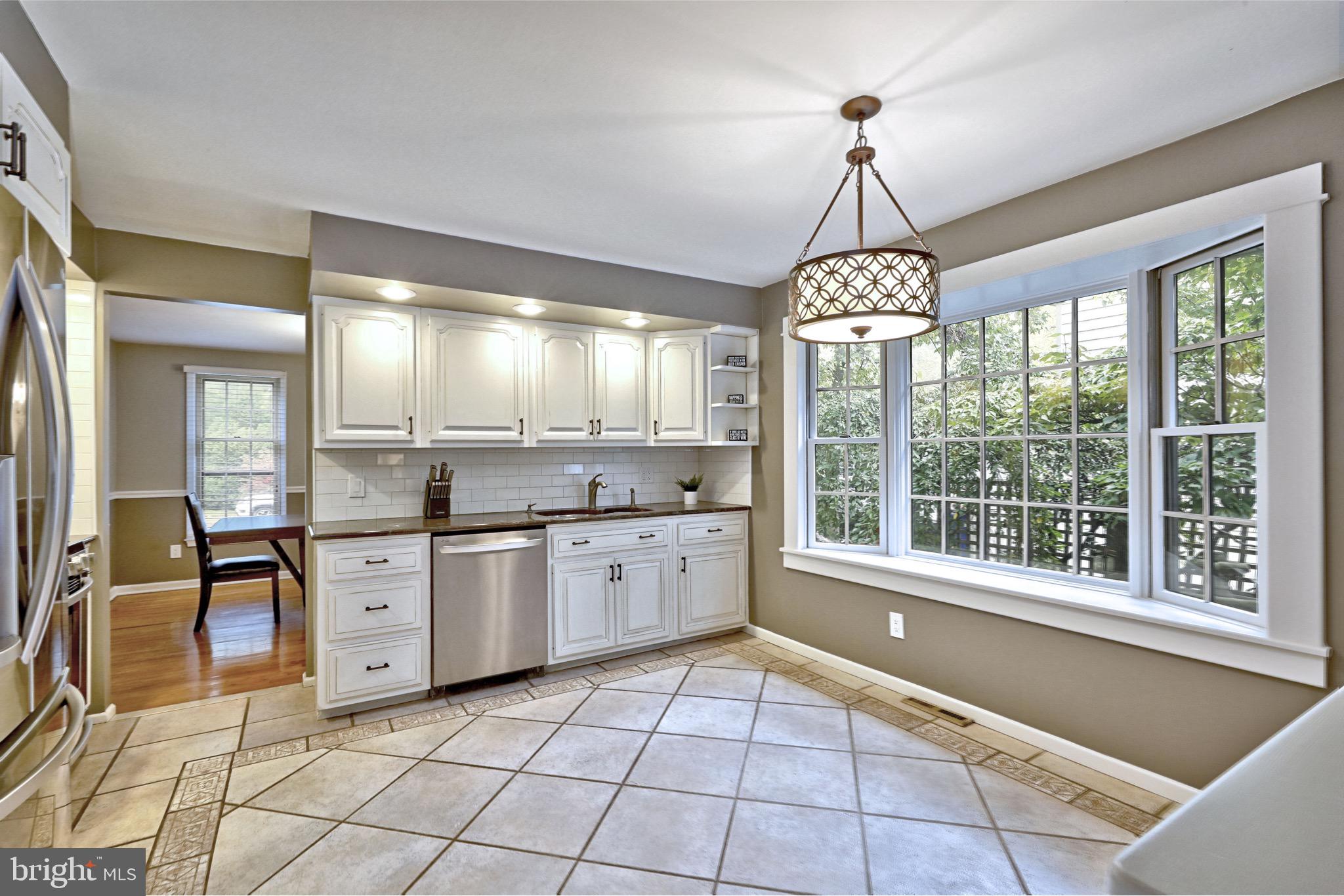 143 Whitemarsh Way Delran, NJ 08075 - Photo 16 of 33 a large kitchen with granite countertop a stove a sink and a dining table chair