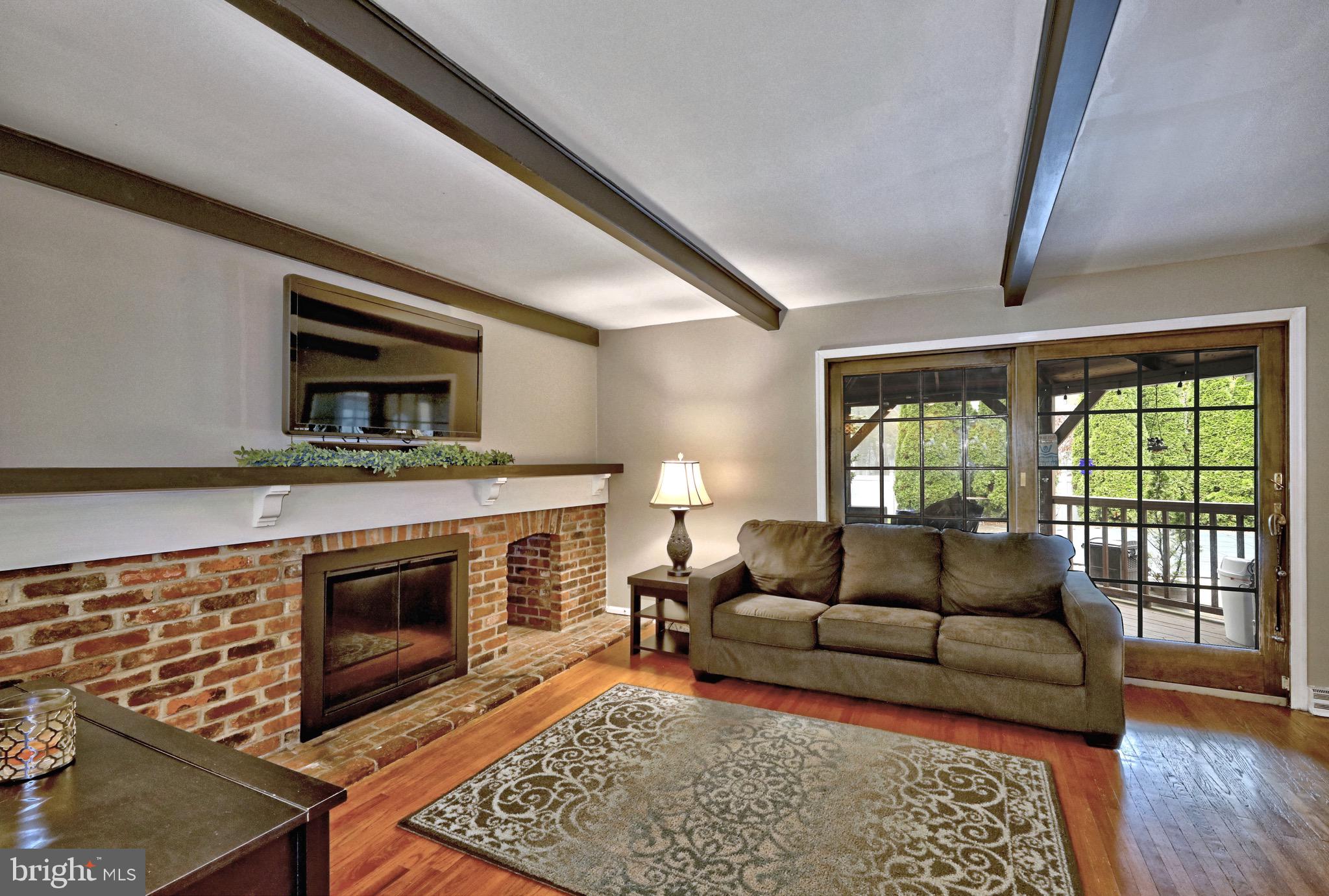 143 Whitemarsh Way Delran, NJ 08075 - Photo 17 of 33 a living room with furniture and a fireplace
