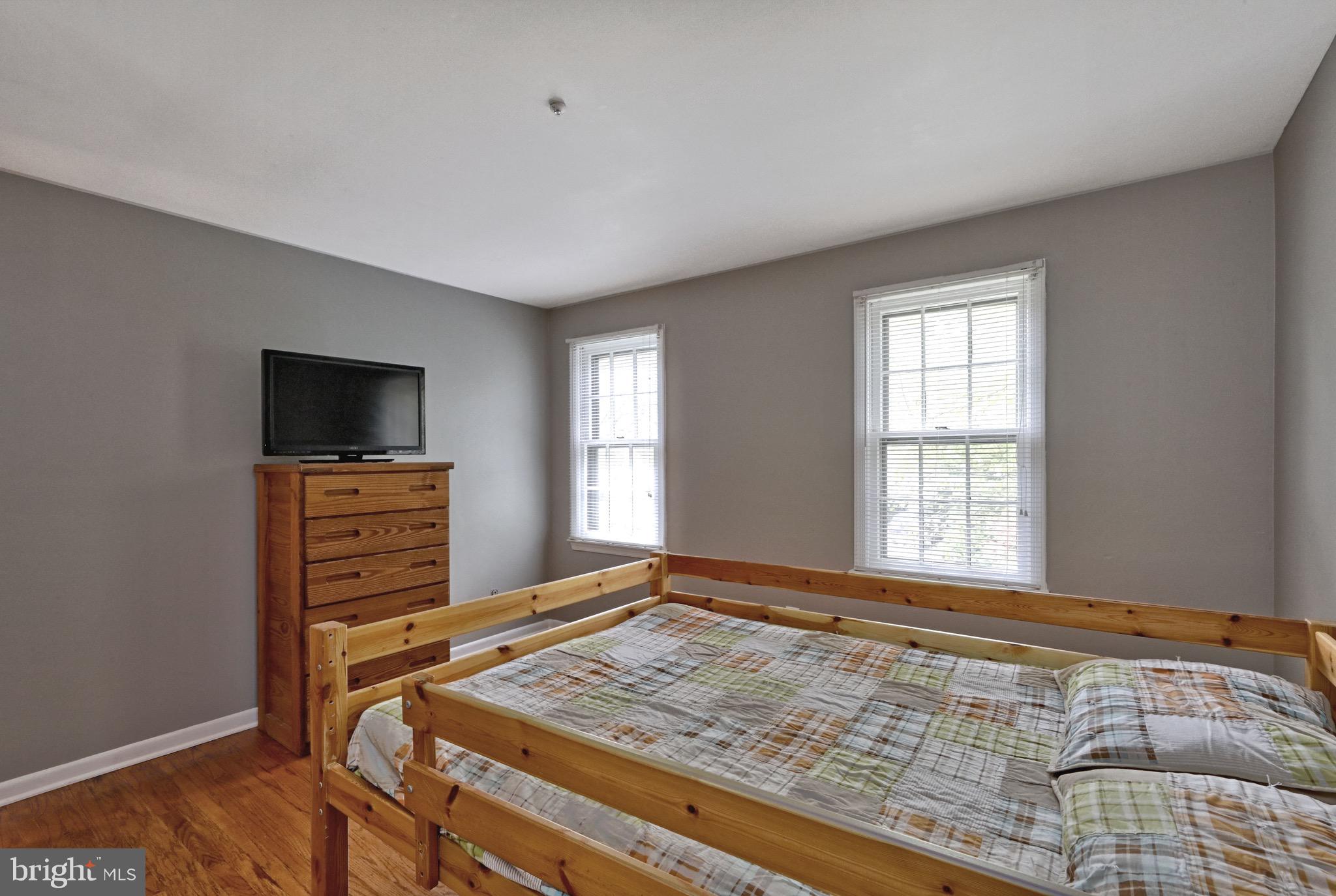 143 Whitemarsh Way Delran, NJ 08075 - Photo 30 of 33 a bedroom with a bed and flat screen tv