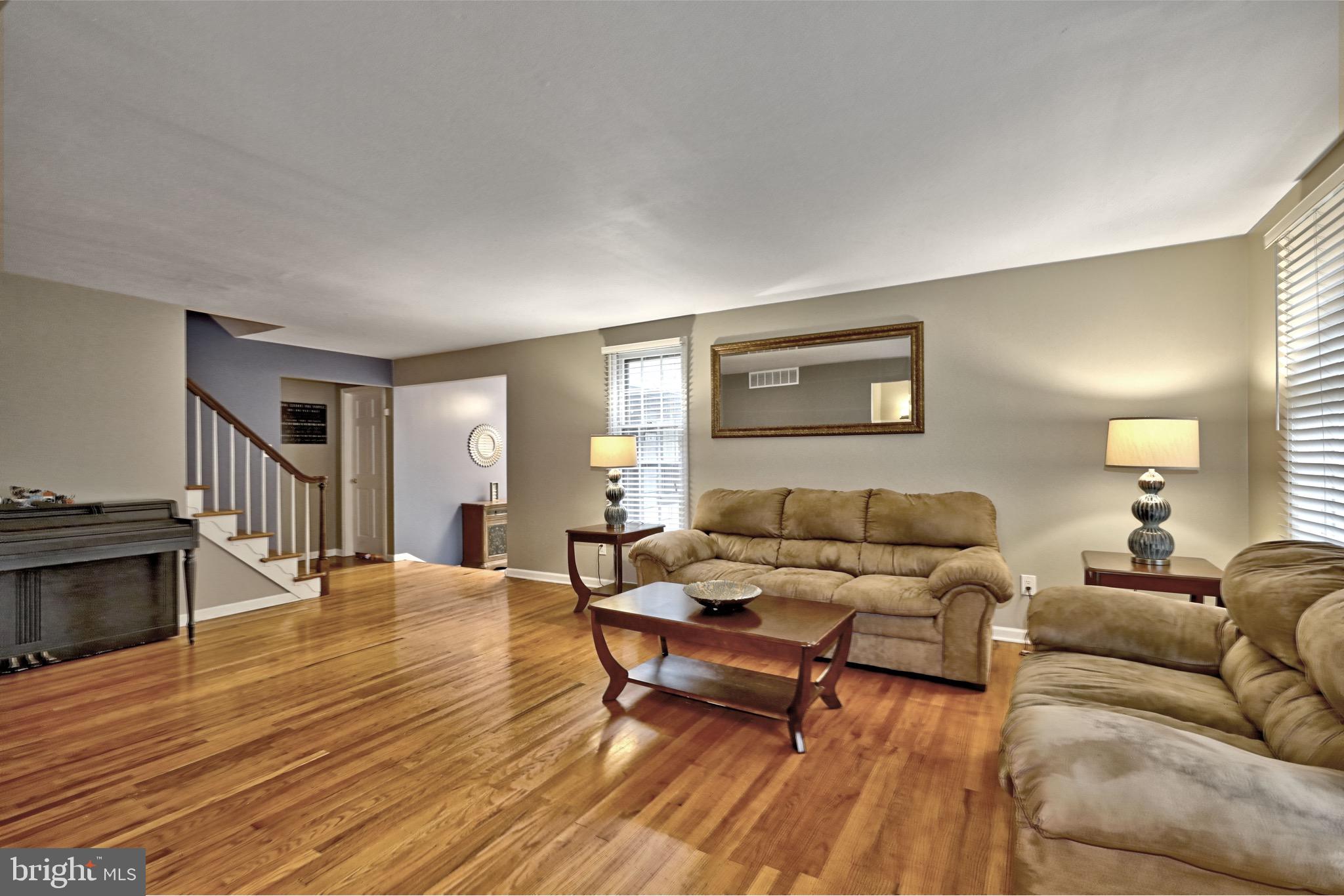 143 Whitemarsh Way Delran, NJ 08075 - Photo 8 of 33 a living room with furniture and a wooden floor