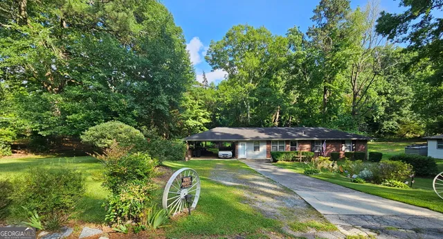 an aerial view of a house with a yard
