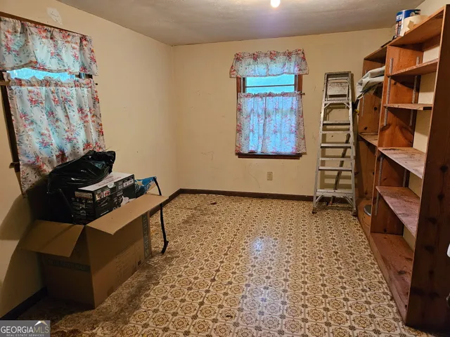 a room with a couch and a stove