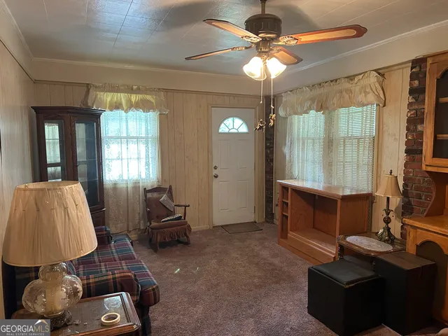 a living room with furniture and a window