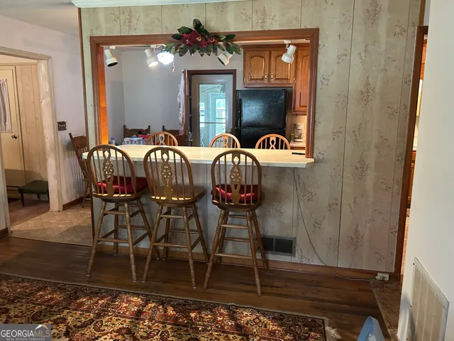 a view of hall way with furniture and chandelier