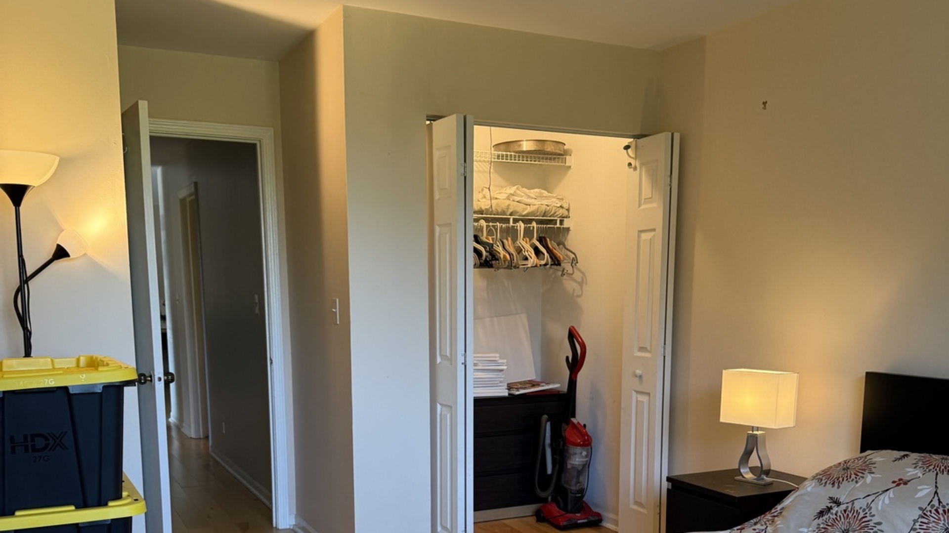 450 Raintree Court, Unit 2B Glen Ellyn, IL 60137 - Photo 7 of 10 a bedroom with a bed and a lamp