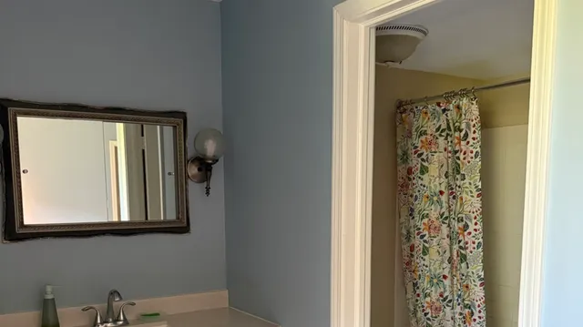 a bathroom with a shower curtain