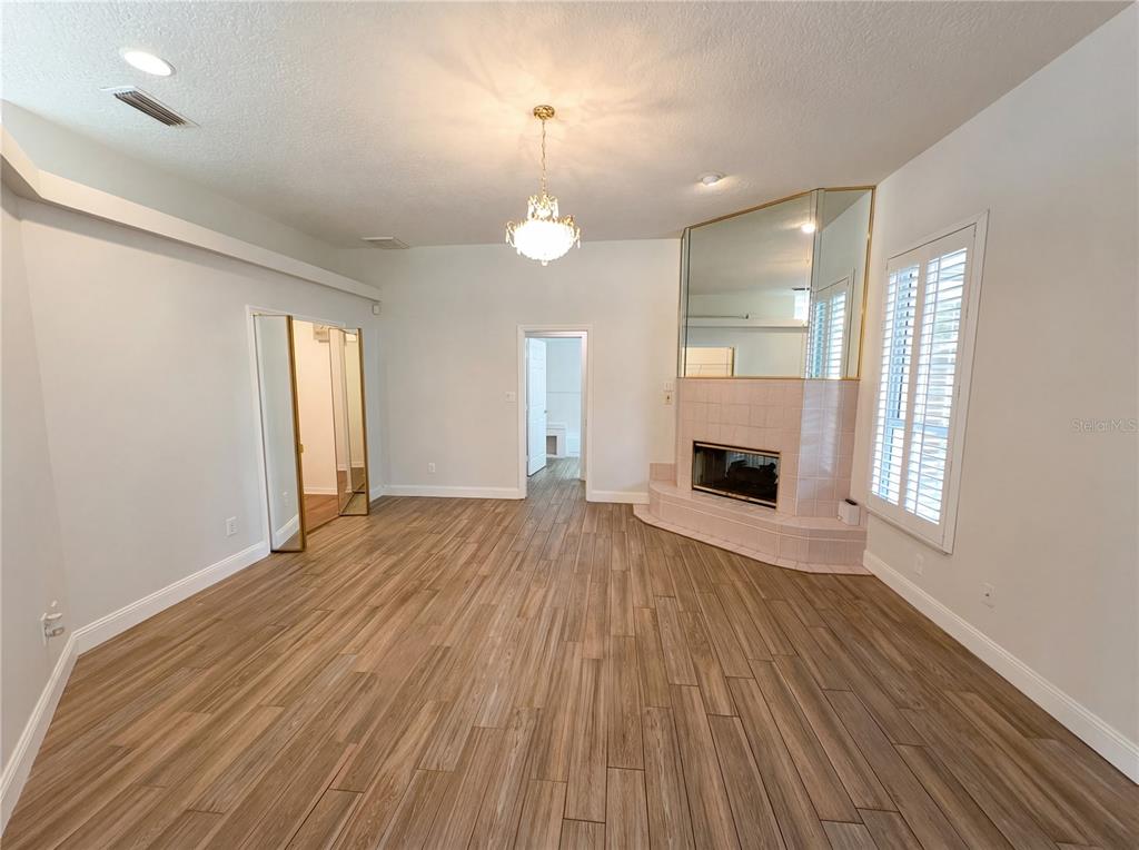 448 MacGregor Road Winter Springs, FL 32708 - Photo 11 of 26 an empty room with wooden floor and windows
