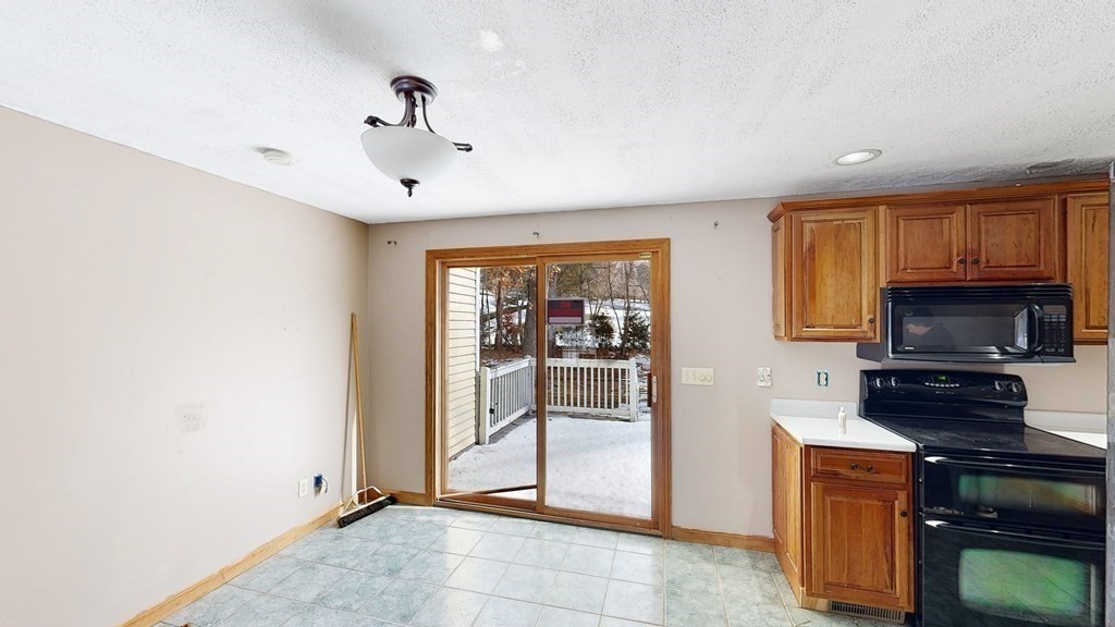 5 Scott Hill Road Ipswich, MA 01938 - Photo 5 of 25 a living room with stainless steel appliances kitchen island granite countertop a stove top oven a sink and a granite counter top
