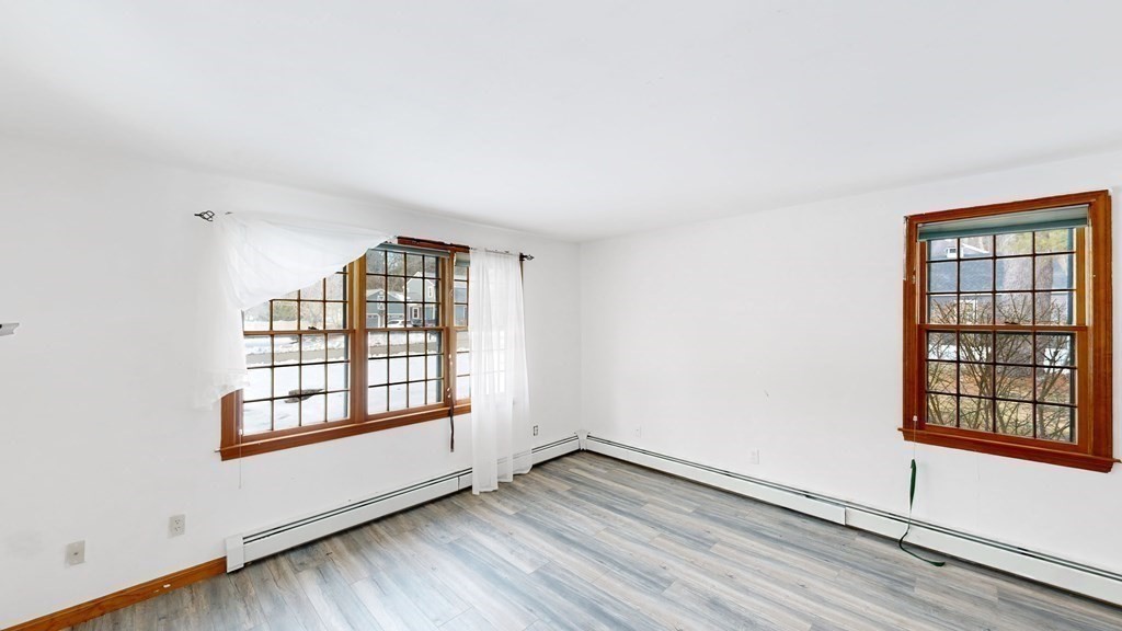 5 Scott Hill Road Ipswich, MA 01938 - Photo 6 of 25 an empty room with wooden floor and windows