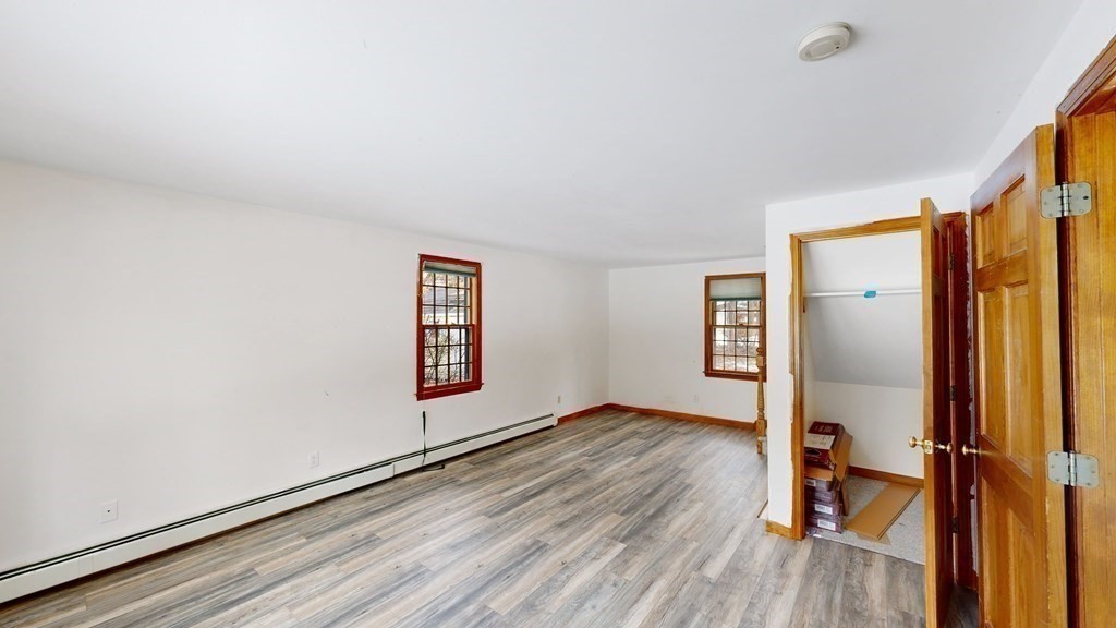 5 Scott Hill Road Ipswich, MA 01938 - Photo 7 of 25 a view of an empty room with wooden floor and a window
