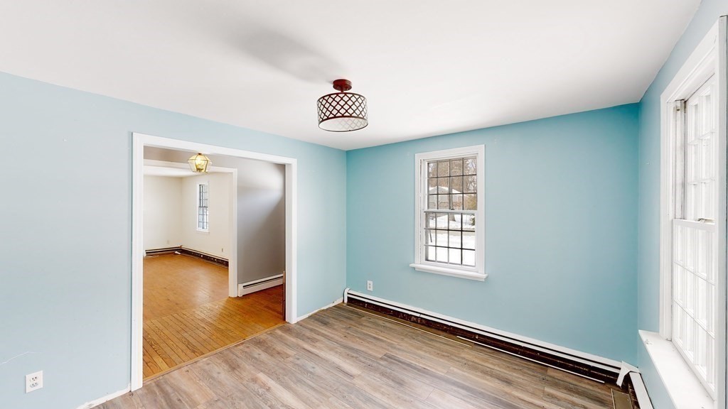 5 Scott Hill Road Ipswich, MA 01938 - Photo 8 of 25 a view of an empty room with wooden floor and a window