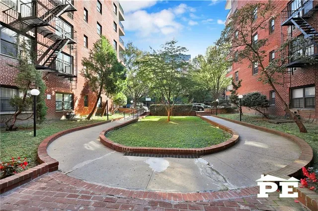 a view of a swimming pool with a yard