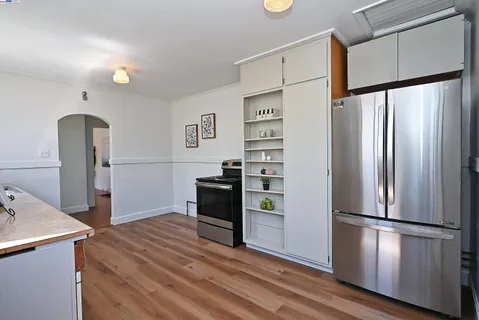 a kitchen with stainless steel appliances a refrigerator sink and microwave