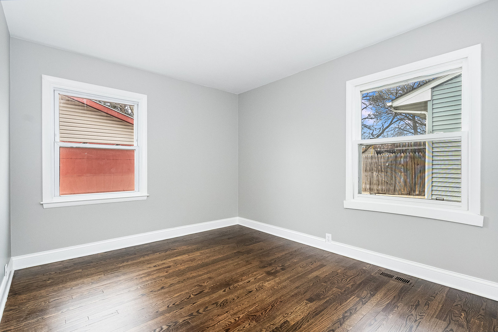 626 Iola Avenue Romeoville, IL 60446 - Photo 12 of 19 a view of an empty room with wooden floor and a window