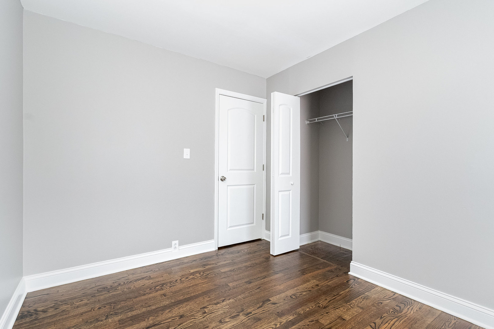 626 Iola Avenue Romeoville, IL 60446 - Photo 15 of 19 a view of an empty room with wooden floor