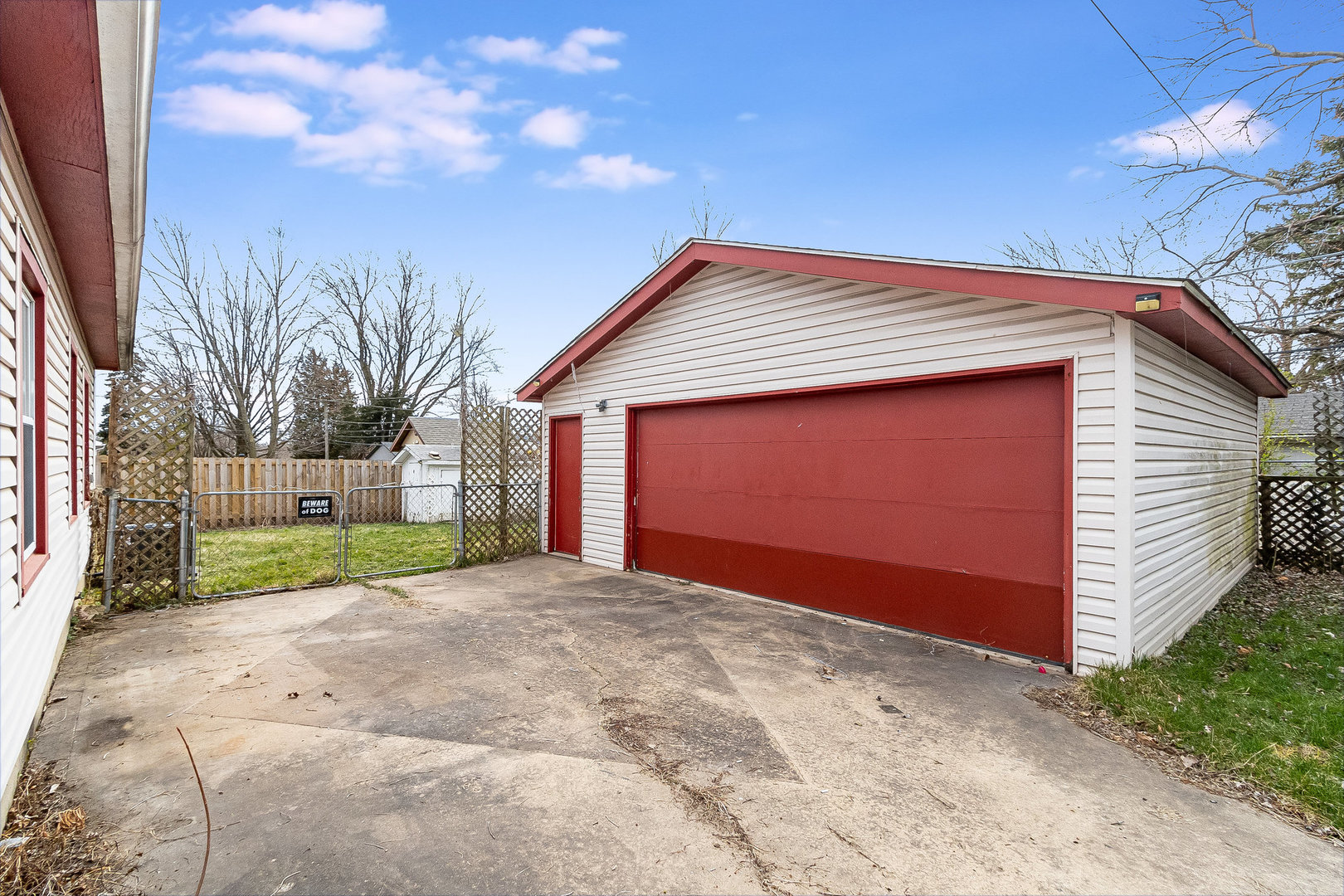 626 Iola Avenue Romeoville, IL 60446 - Photo 17 of 19 a view of yellow house with a yard and garage