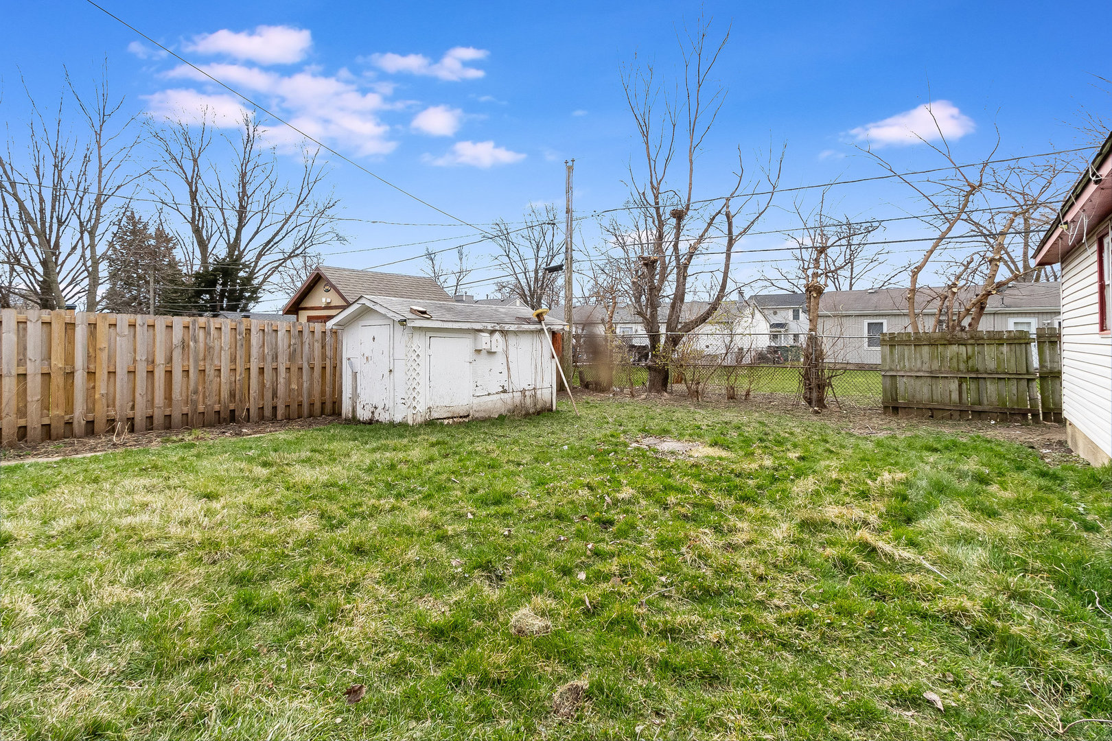 626 Iola Avenue Romeoville, IL 60446 - Photo 19 of 19 a view of a backyard with a tree