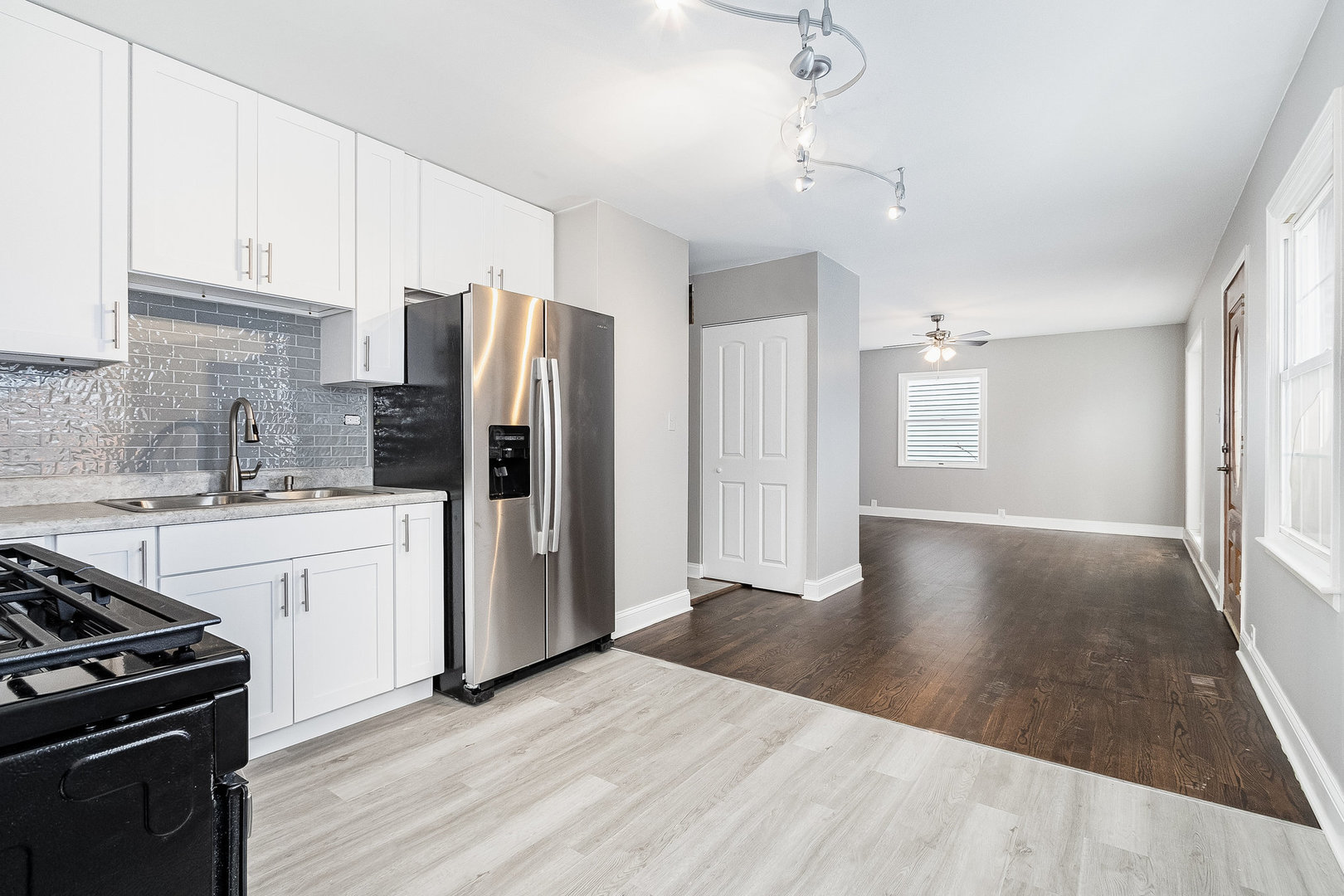 626 Iola Avenue Romeoville, IL 60446 - Photo 5 of 19 a kitchen with granite countertop a refrigerator stove and sink