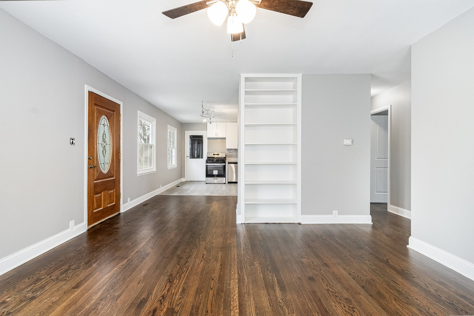 626 Iola Avenue Romeoville, IL 60446 - Photo 6 of 19 a view of empty room with wooden floor