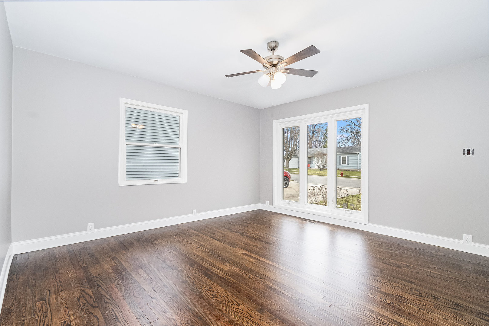 626 Iola Avenue Romeoville, IL 60446 - Photo 10 of 19 a view of an empty room with wooden floor and a window
