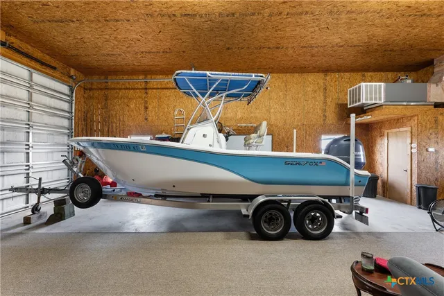 a room with refrigerator and window