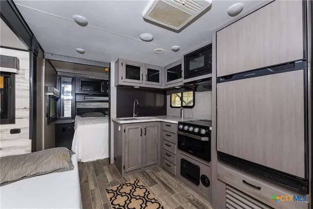 a bedroom with a bed and a television