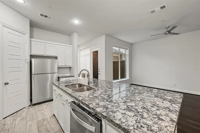 a view of staircase with wooden floor and white walls