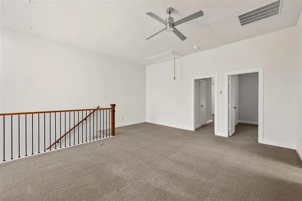 a view of a big room with carpet