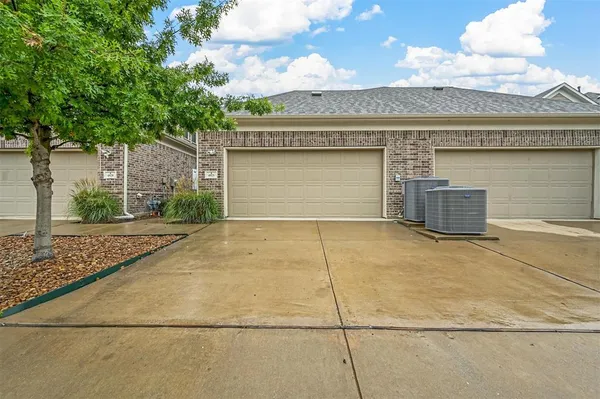 a picture of a bench in room with a white wall