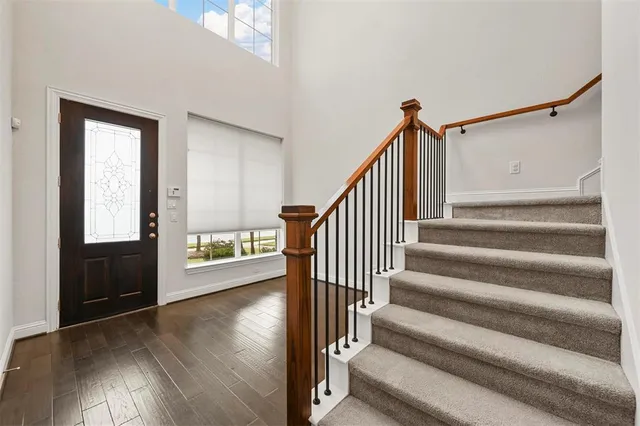 an empty room with a empty space and a ceiling fan