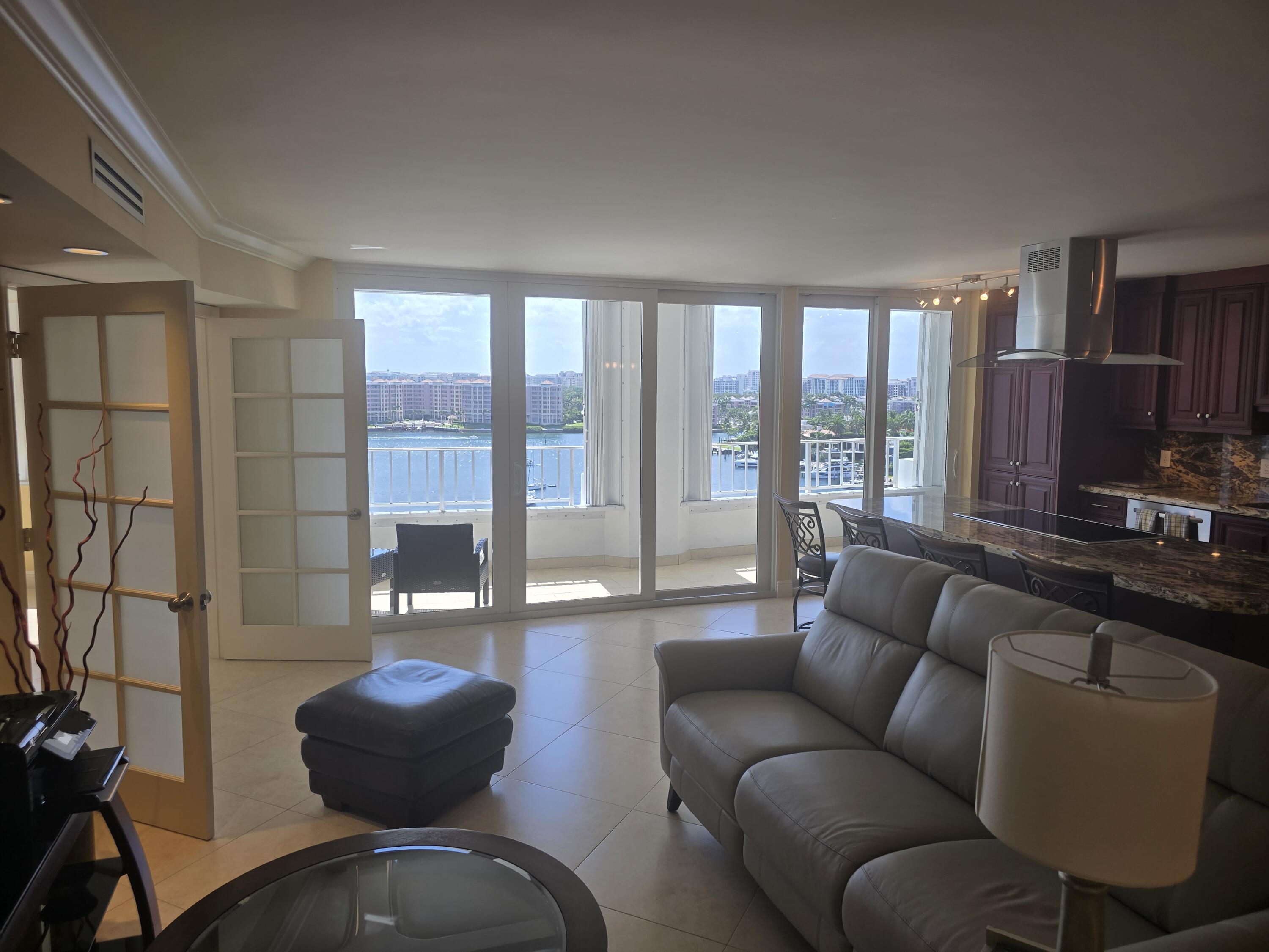 500 South Ocean Boulevard, Unit 1109 Boca Raton, FL 33432 - Photo 32 of 89 a living room with furniture and a floor to ceiling window