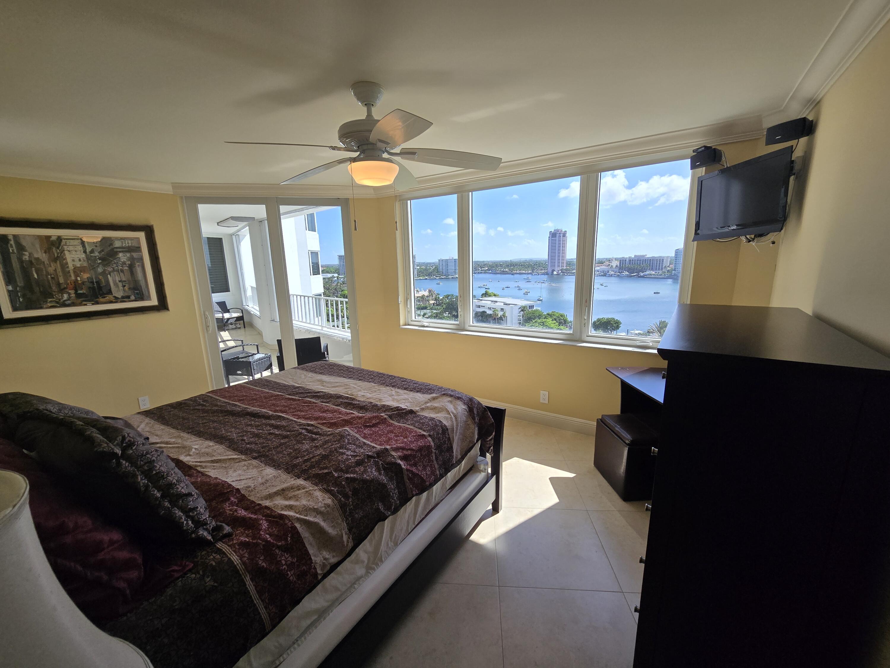 500 South Ocean Boulevard, Unit 1109 Boca Raton, FL 33432 - Photo 36 of 89 a bed sitting in a bedroom next to a window