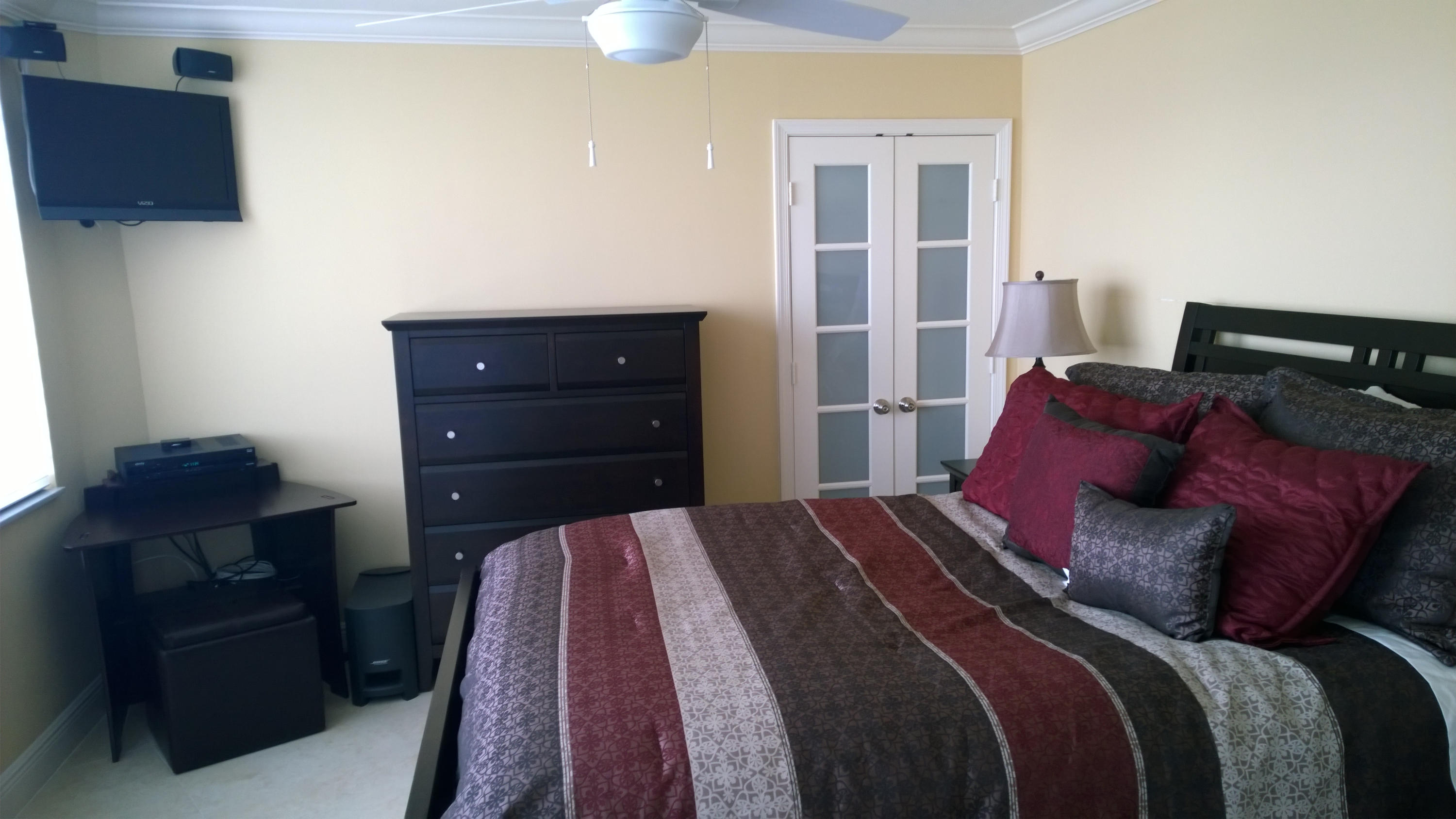 500 South Ocean Boulevard, Unit 1109 Boca Raton, FL 33432 - Photo 47 of 89 a bedroom with a bed and a dresser