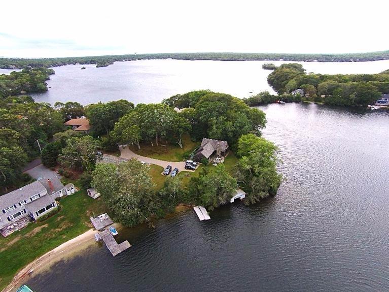 276 Holly Point Road Centerville, MA 02632 - Photo 1 of 14 an aerial view of a houses with ocean view