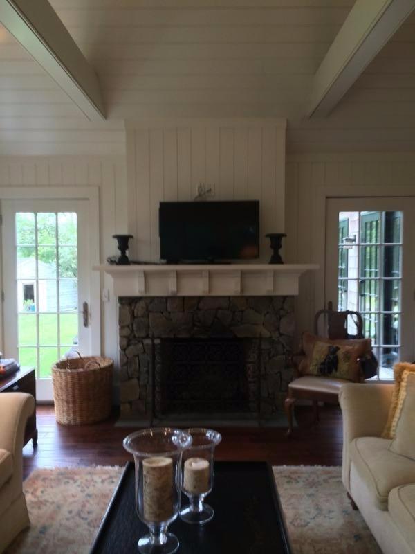 276 Holly Point Road Centerville, MA 02632 - Photo 13 of 14 a living room with furniture a flat screen tv and a fireplace