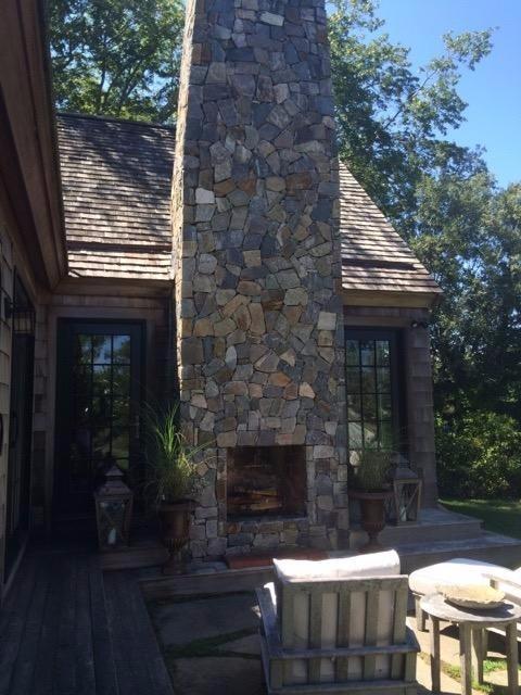 276 Holly Point Road Centerville, MA 02632 - Photo 5 of 14 a front view of a house with a yard