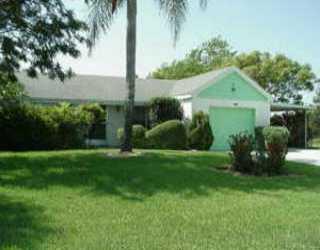 a view of a garden with a building in front of it