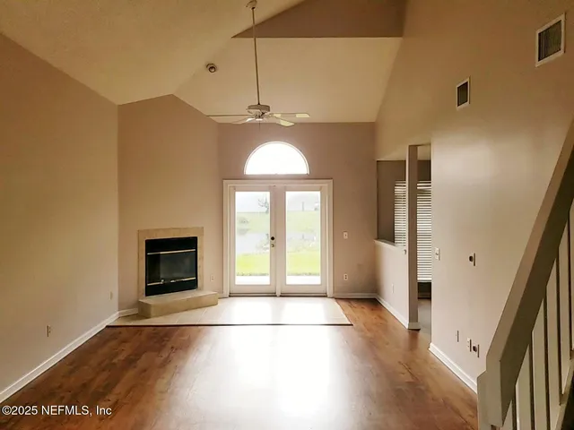 a white toilet sitting next to a bath tub