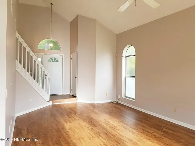 a view of an empty room with a window
