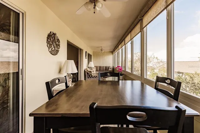 a view of kitchen dining table and chairs
