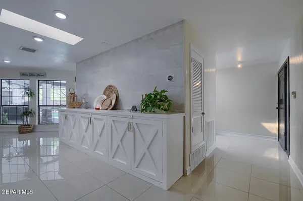a kitchen with a table and chairs
