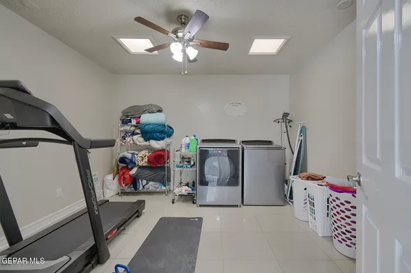 an aerial view of a house with a mountain