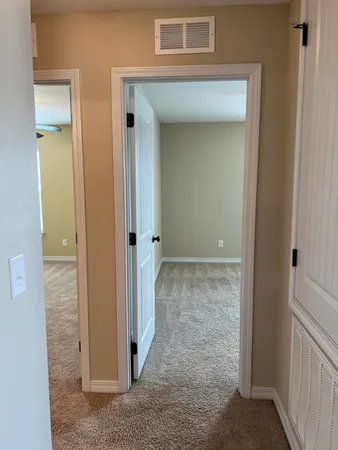 a view of a hallway with closet