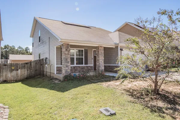 a view of a house with a yard