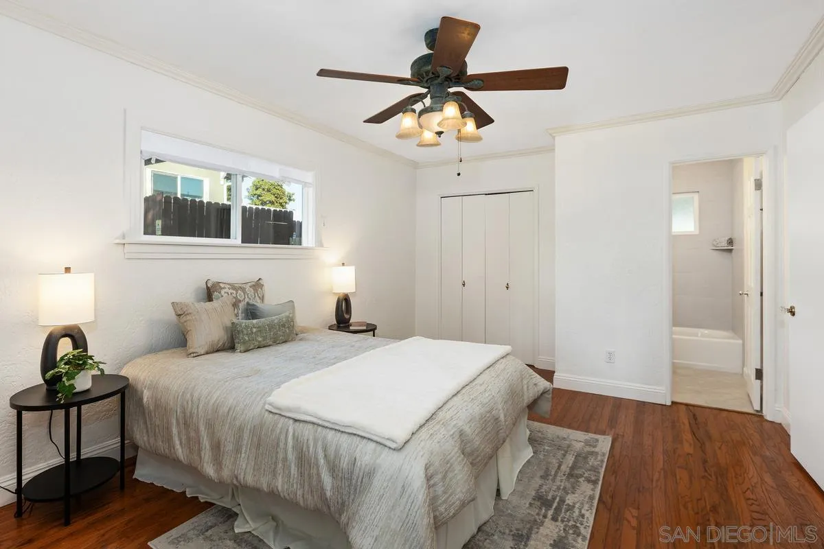 2707 Sweetwater Road Spring Valley, CA 91977 - Photo 6 of 30 a bedroom with a bed and a chandelier