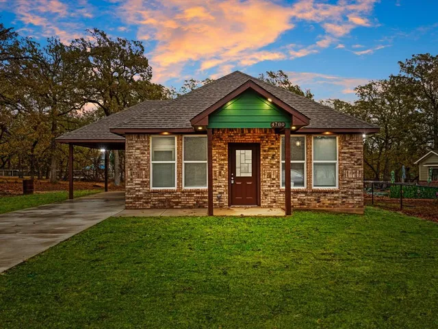 front view of a house with a yard