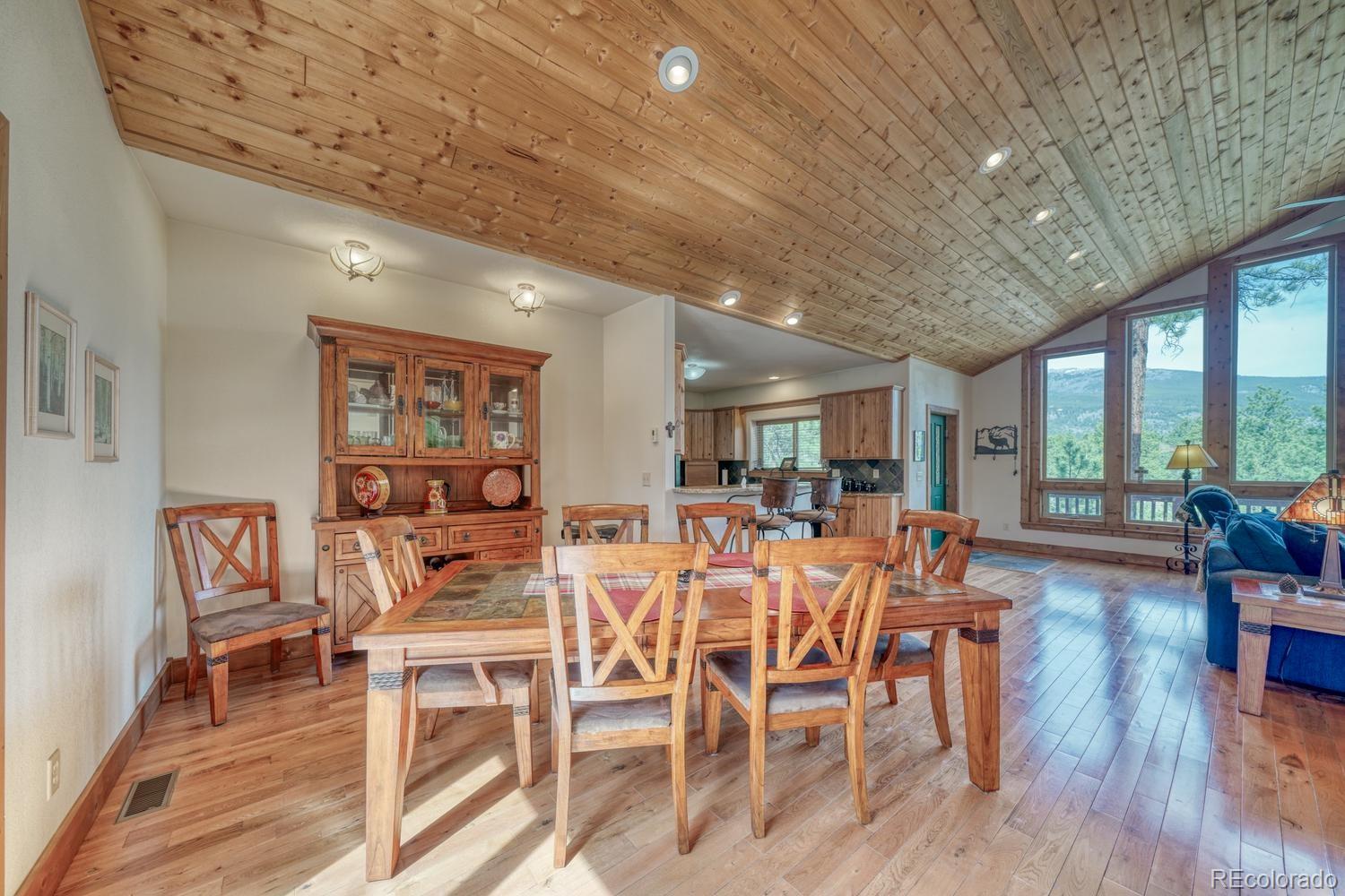 30800 West Ridge Road Buena Vista, CO 81211 - Photo 15 of 49 a view of a dining room with furniture window and wooden floor