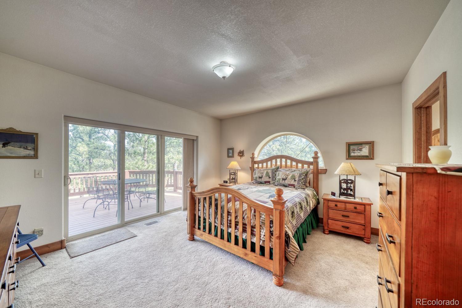 30800 West Ridge Road Buena Vista, CO 81211 - Photo 16 of 49 a bedroom with a bed and a large window with the outer view