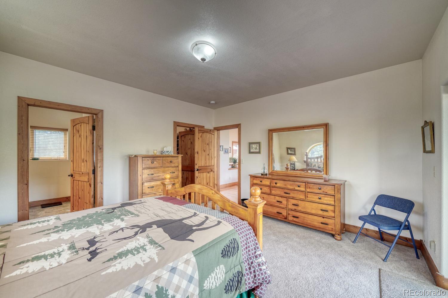 30800 West Ridge Road Buena Vista, CO 81211 - Photo 17 of 49 a bedroom with a bed and furniture