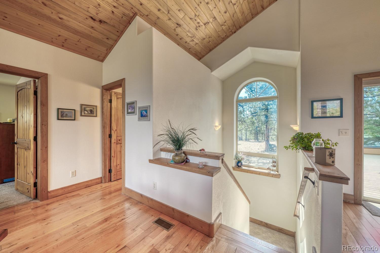 30800 West Ridge Road Buena Vista, CO 81211 - Photo 21 of 49 a view of an entryway with wooden floor and a livingroom